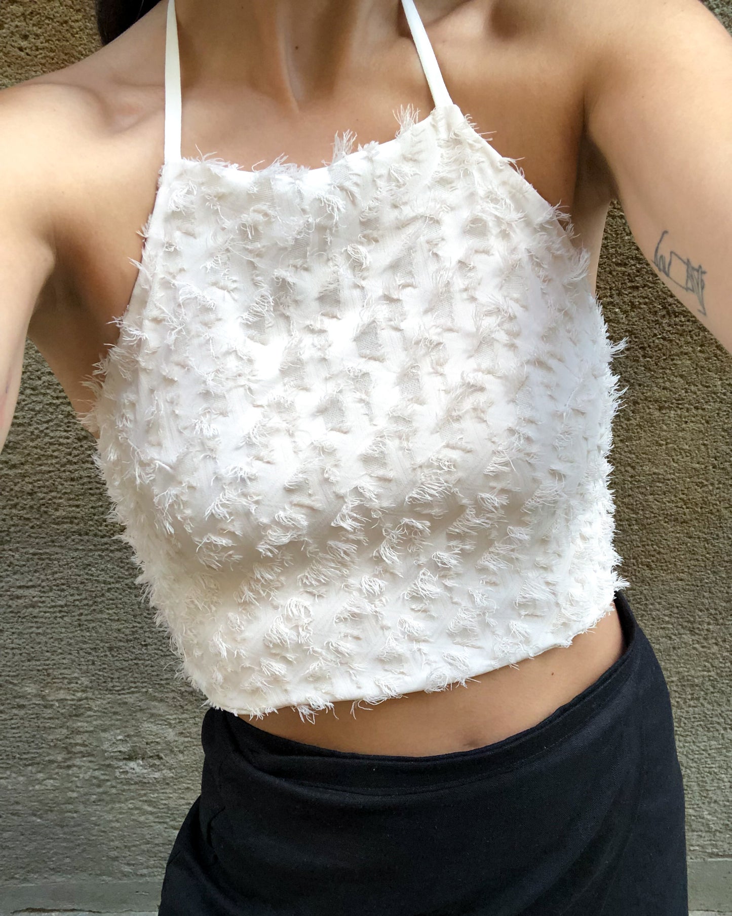 The top, beige textured viscose.