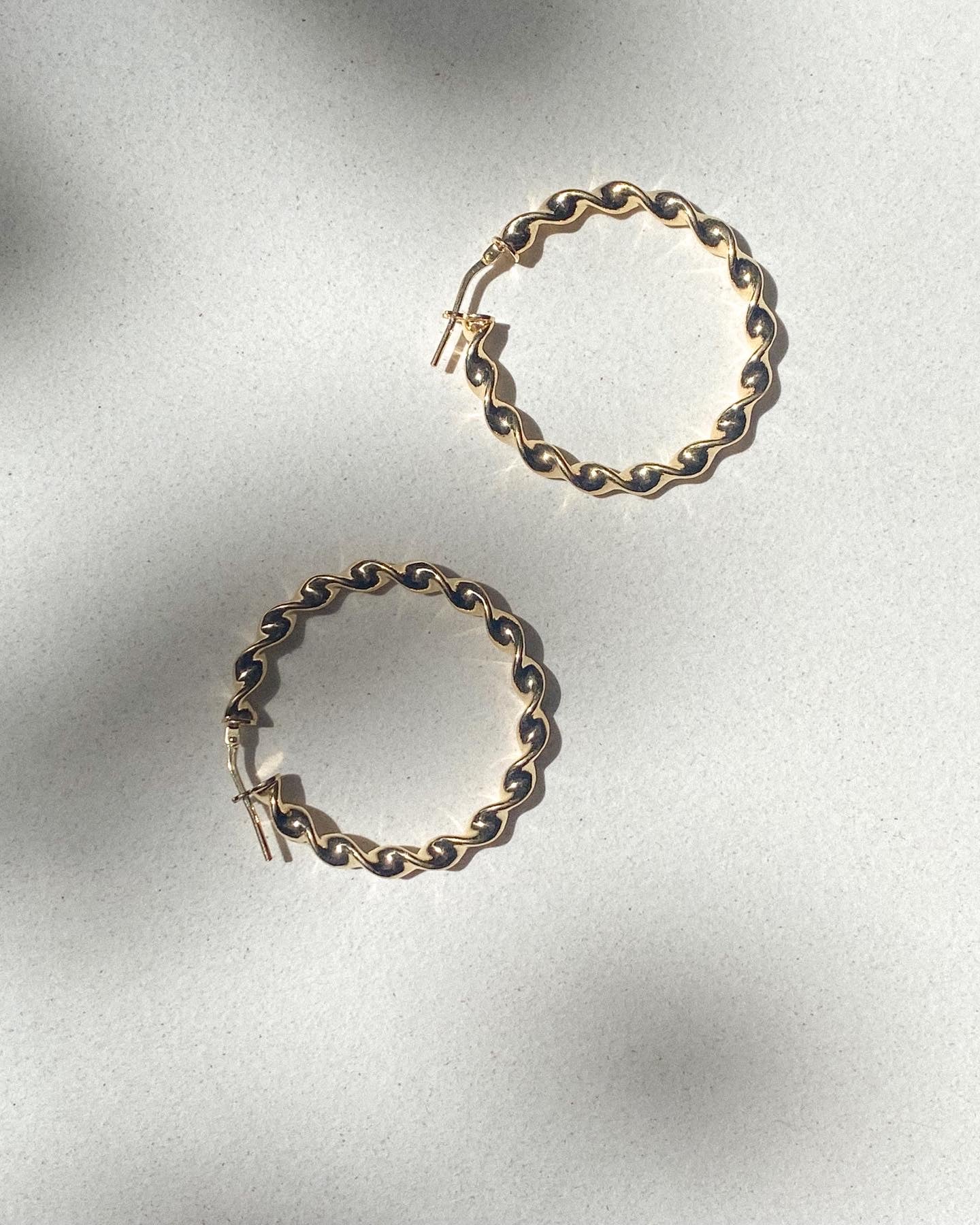 Twisted silver 925 hoops.