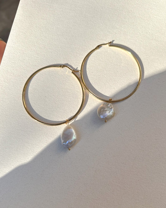 Gold plated hoops with pearls.