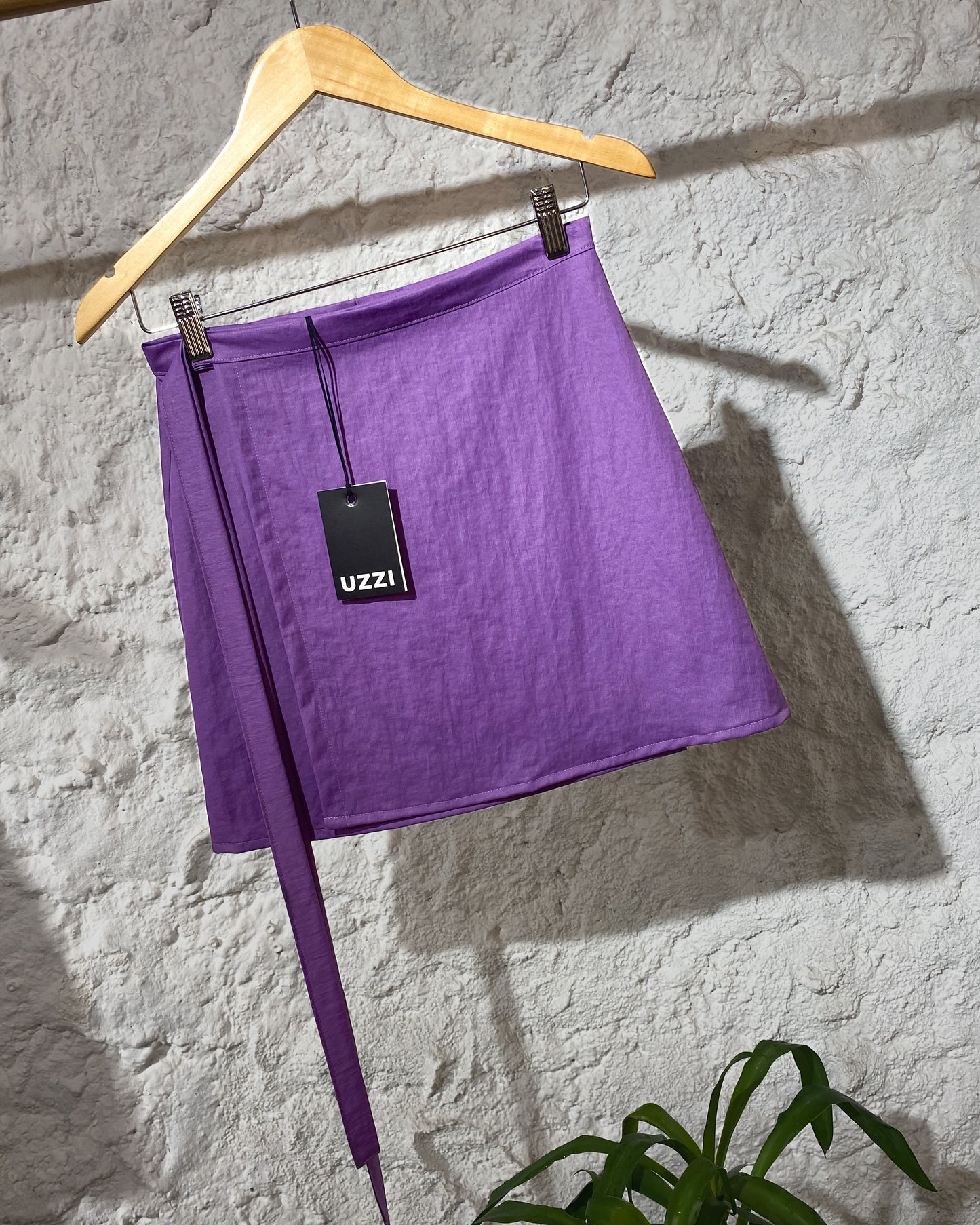 Waxed purple mini wrap skirt.