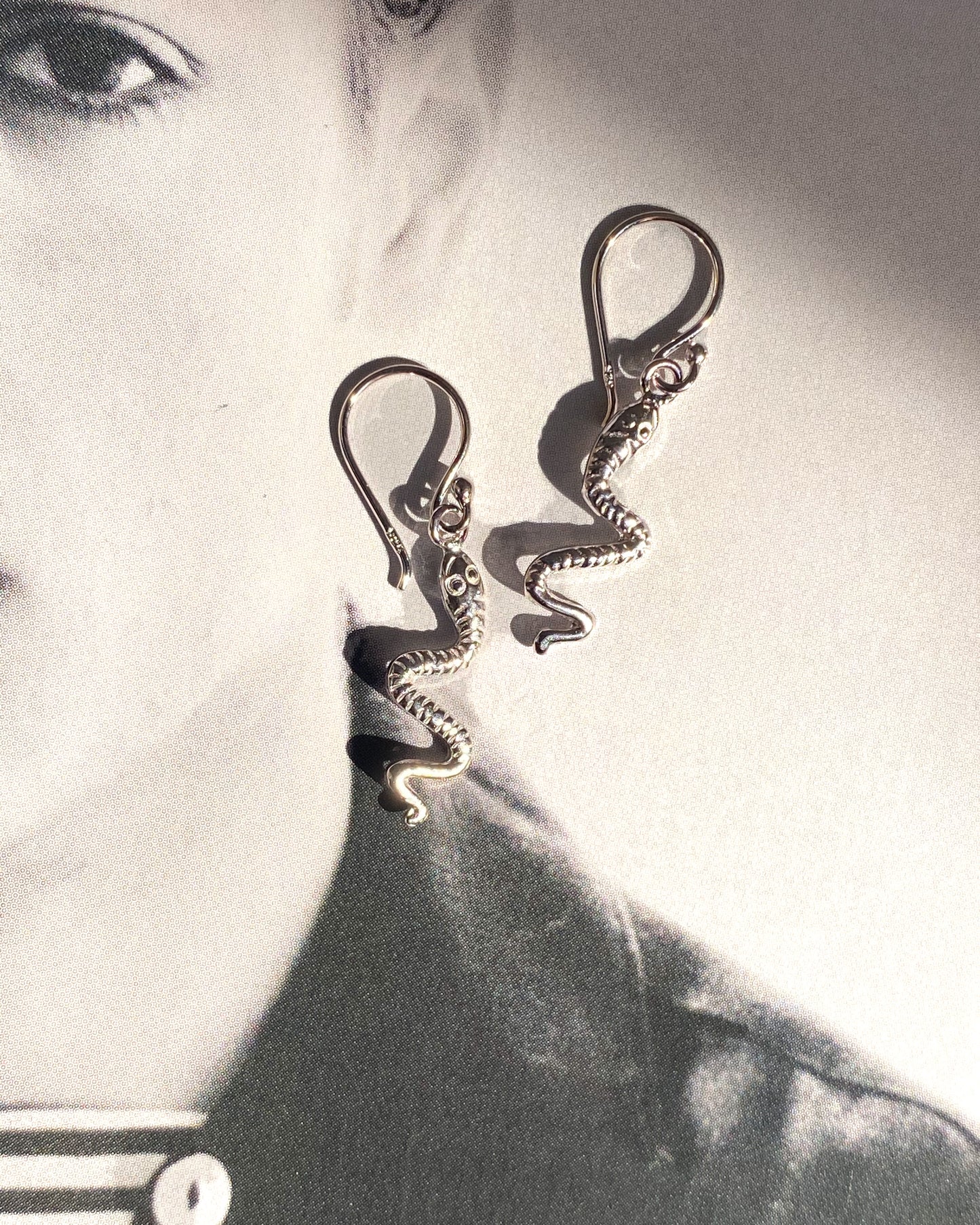 The serpent earrings.